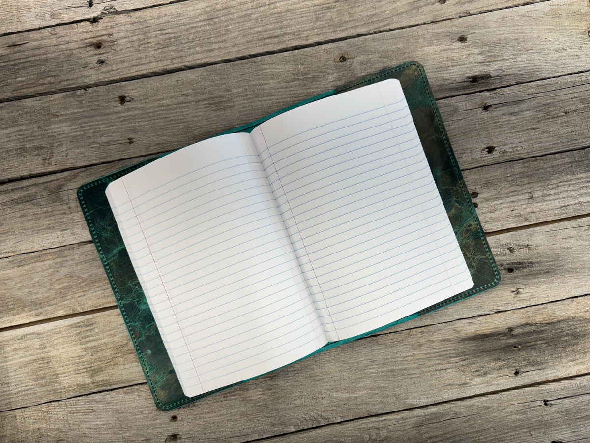 Open notebook on a wooden surface