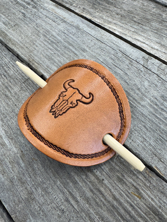 Hand stamped cow skull leather hair barrette with rope border and bamboo hair stick.