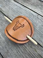 Hand stamped cow skull leather hair barrette with rope border and bamboo hair stick.