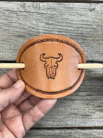Hand stamped cow skull leather hair barrette with rope border and bamboo hair stick.