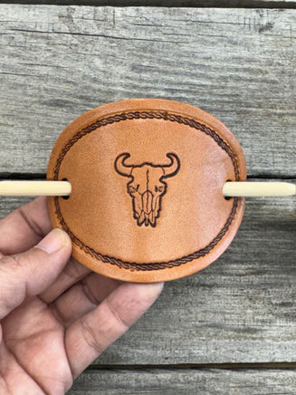 Hand stamped cow skull leather hair barrette with rope border and bamboo hair stick.