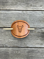 Hand stamped cow skull leather hair barrette with rope border and bamboo hair stick.
