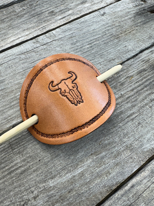 Hand stamped cow skull leather hair barrette with rope border and bamboo hair stick.