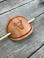 Hand stamped cow skull leather hair barrette with rope border and bamboo hair stick.