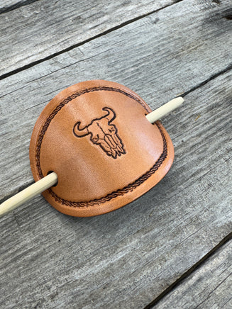 Hand stamped cow skull leather hair barrette with rope border and bamboo hair stick.