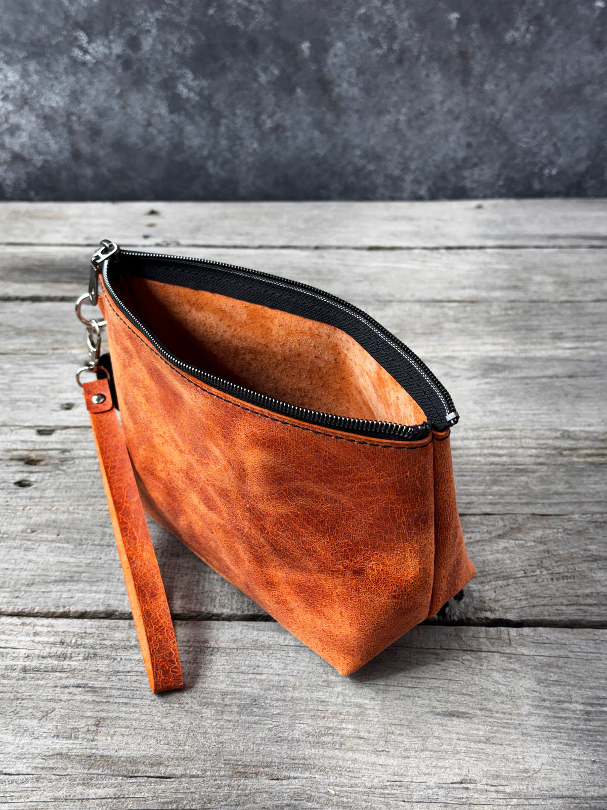 Genuine leather large cosmetic wristlet bag in rustic burnt orange
