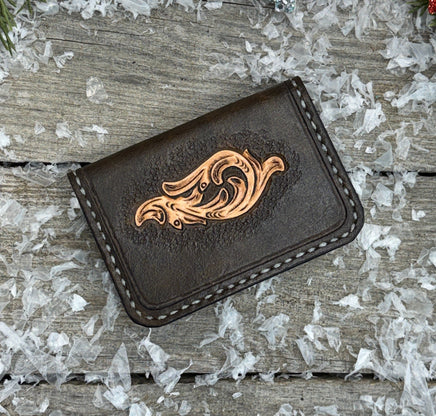 Hand-carved chocolate brown leather card wallet with floral scroll design and gray oil-tanned interior, handmade by Cherokee Rose Custom Leather.