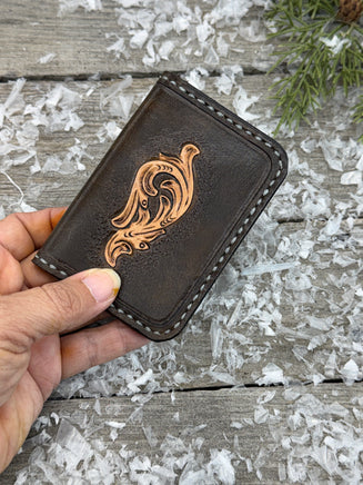 Hand-carved chocolate brown leather card wallet with floral scroll design and gray oil-tanned interior, handmade by Cherokee Rose Custom Leather.