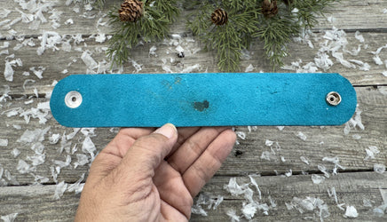 Hand-carved leather cuff bracelet with turquoise flower and floral scrollwork, silver snaps, turquoise suede back, handmade by Cherokee Rose Custom Leather in Texas.
