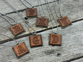 Hand Stamped Leather Initial Necklace – Floral Script Font