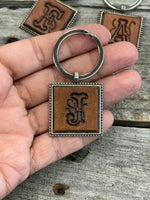 Hand Stamped Leather Initial Keychains – Floral Script Font