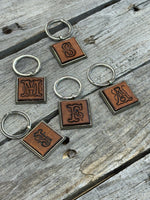 Hand Stamped Leather Initial Keychains – Floral Script Font