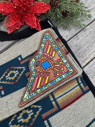 Southwest woven messenger bag with hand-painted leather Thunderbird patch, handmade by Cherokee Rose Custom Leather in East Texas.