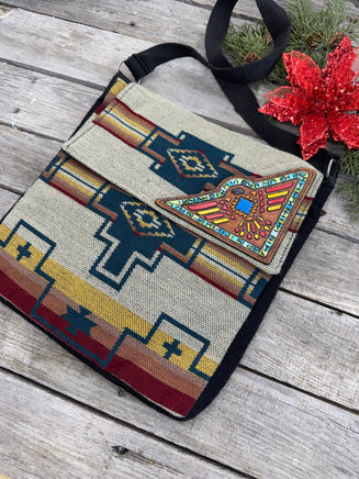 Southwest woven messenger bag with hand-painted leather Thunderbird patch, handmade by Cherokee Rose Custom Leather in East Texas.
