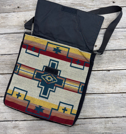Southwest woven messenger bag with hand-painted leather Thunderbird patch, handmade by Cherokee Rose Custom Leather in East Texas.