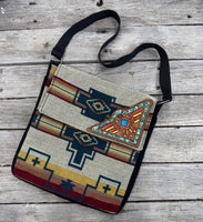 Southwest woven messenger bag with hand-painted leather Thunderbird patch, handmade by Cherokee Rose Custom Leather in East Texas.