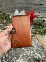 Hand-carved feather and floral leather memo pad holder in English Bridle brown with black accents, handmade by Cherokee Rose Custom Leather.