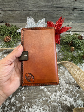 Hand-carved feather and floral leather memo pad holder in English Bridle brown with black accents, handmade by Cherokee Rose Custom Leather.