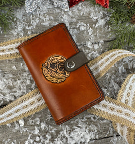 Hand-carved feather and floral leather memo pad holder in English Bridle brown with black accents, handmade by Cherokee Rose Custom Leather.