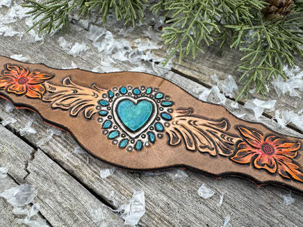 Hand-carved leather cuff bracelet with turquoise heart, orange flowers, and antique copper snaps, handmade by Cherokee Rose Custom Leather in East Texas.
