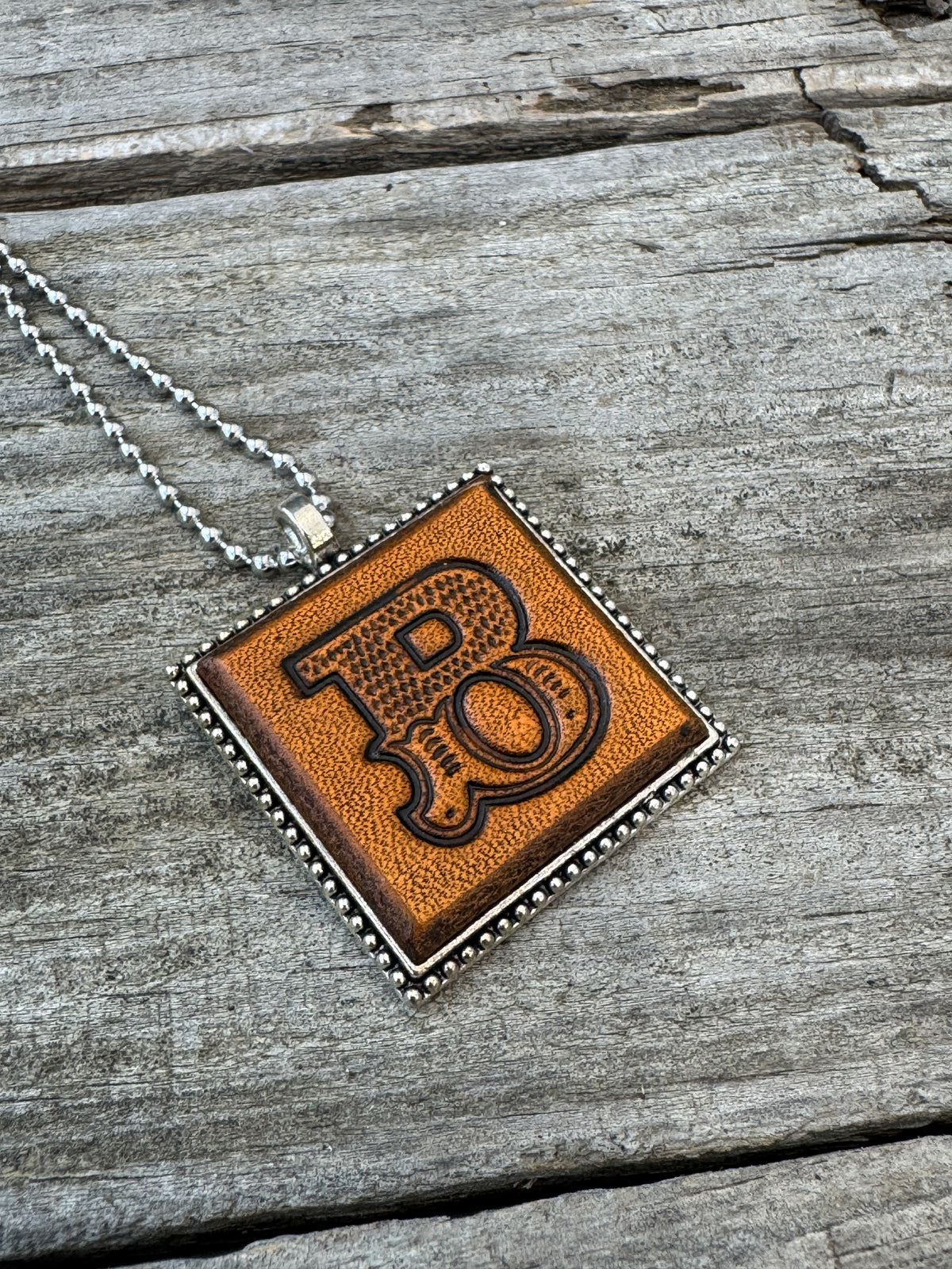 Western Block letter B hand-stamped leather pendant necklace in a silver-tone square frame