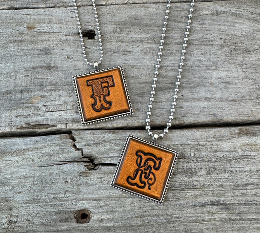 Letter F leather initial necklaces in Western Block and Floral Script fonts on silver ball chains