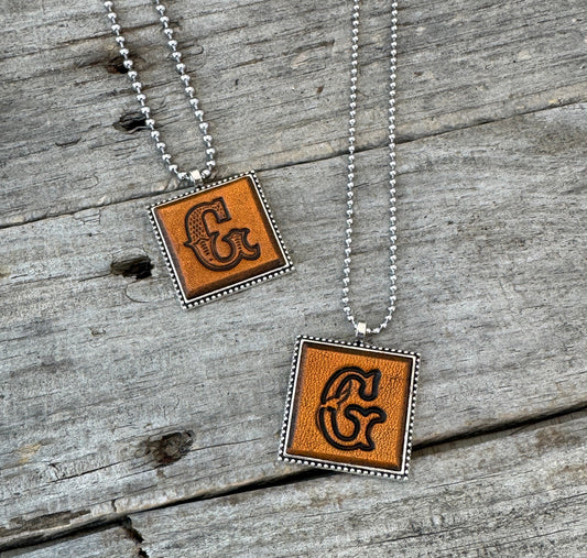 Letter G leather initial necklaces in Western Block and Floral Script fonts on silver ball chains