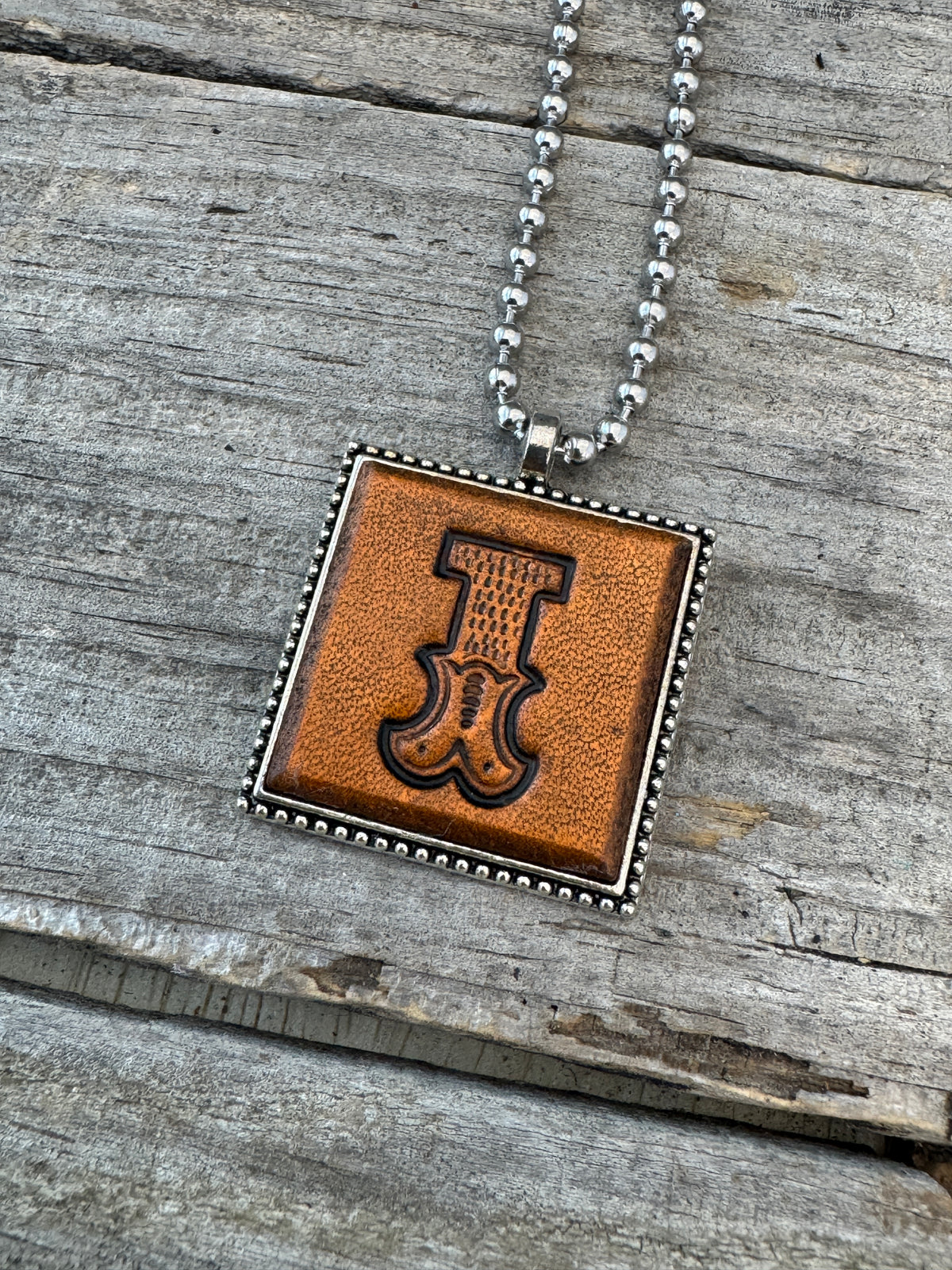 Western Block Letter I leather initial necklace featuring bold cowboy-inspired lettering stamped into genuine brown leather.