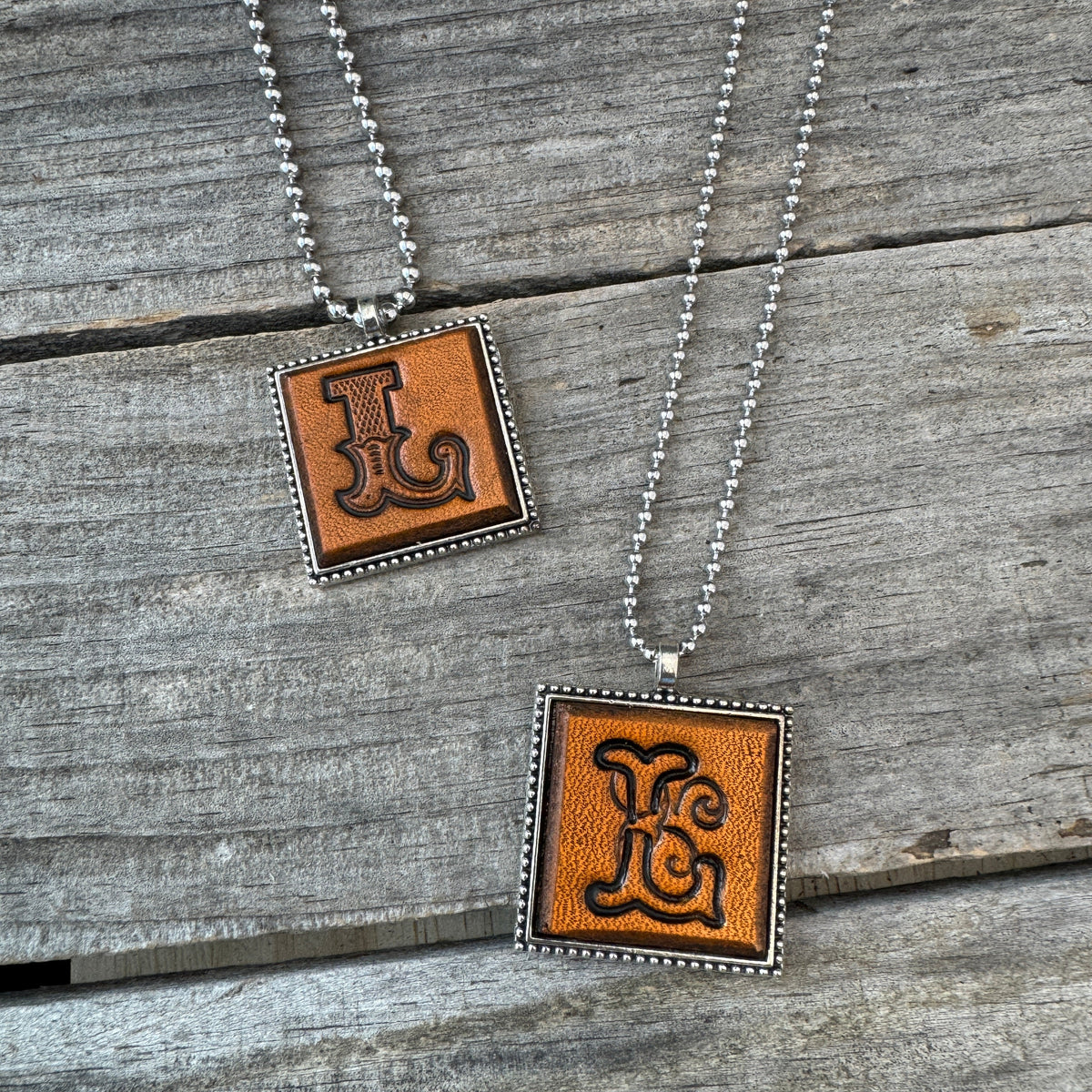 Handmade Letter L leather initial necklaces in Western Block and Floral Script fonts