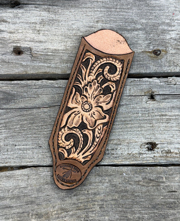 Decorative leather embossment on a wooden surface