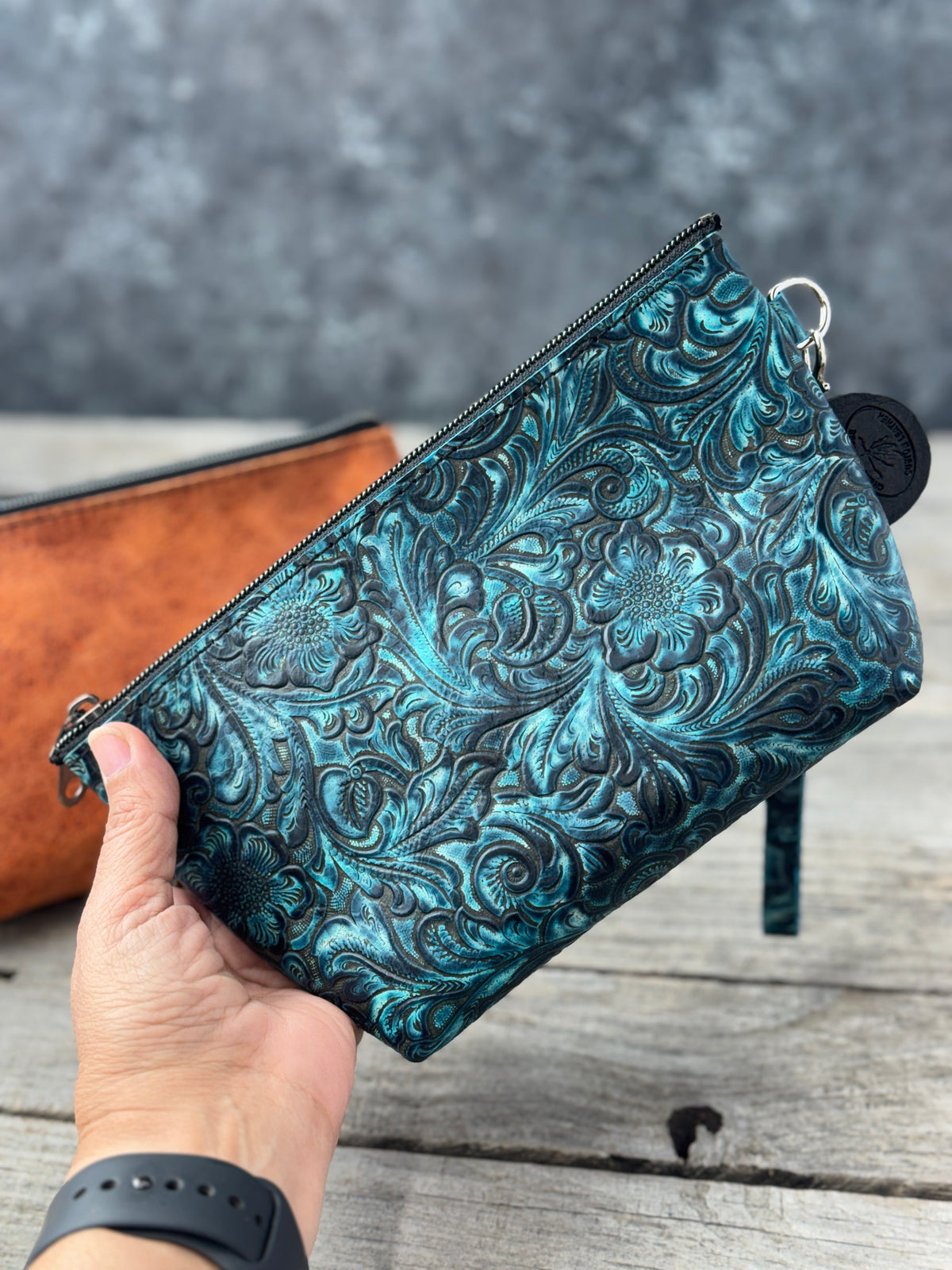 Medium leather cosmetic wristlet pouch with structured shape
