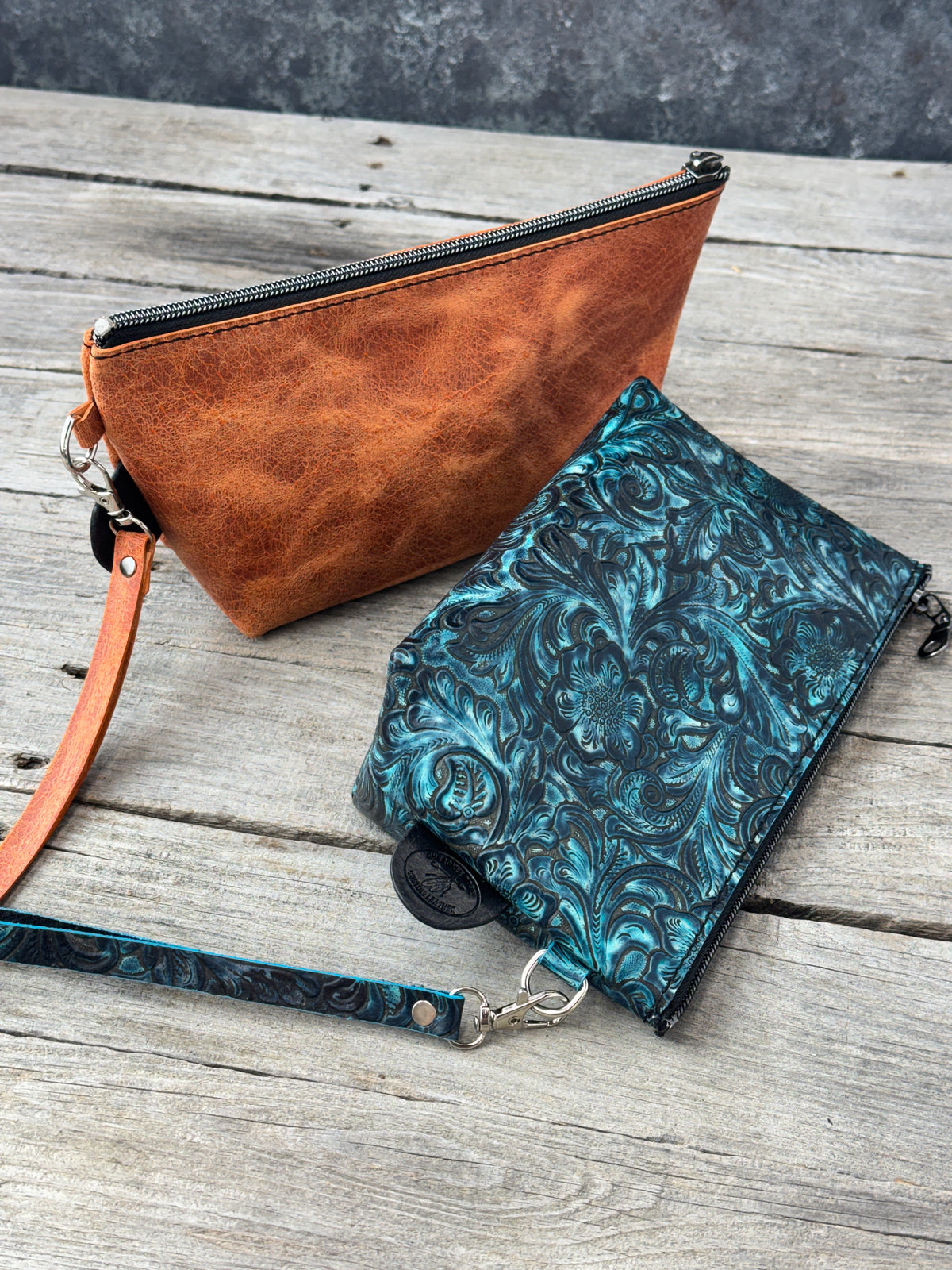 Genuine leather zippered cosmetic bags with silver tone hardware