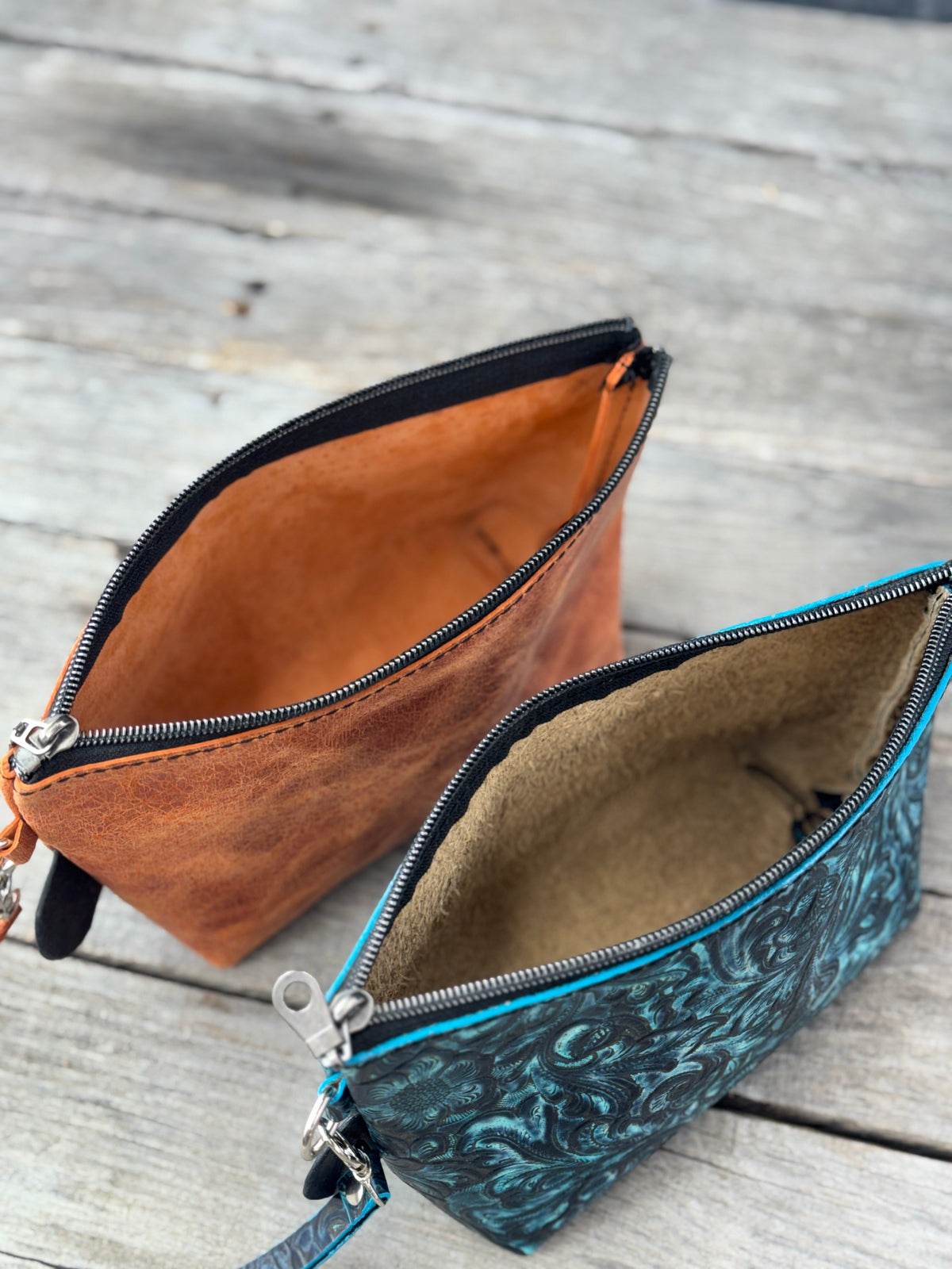 Handcrafted medium leather toiletry pouches in orange and turquoise floral
