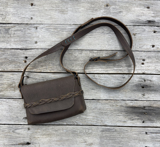 minimalist leather crossbody bag with mystery braid closure rustic brown