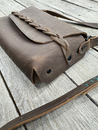 leather bag with braided closure detail minimalist design brown leather purse