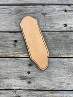 Hand tooled leather cast iron skillet handle cover with oak leaf and acorn carving, light tan dye, handmade by Cherokee Rose Custom Leather in East Texas.