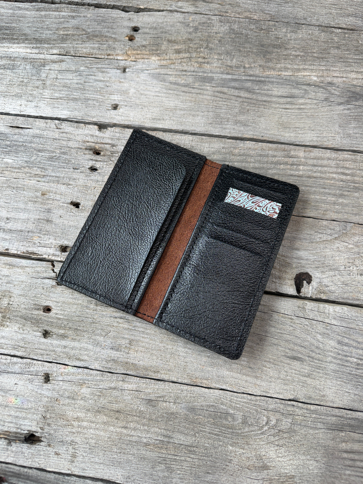 Redwood roper wallet open showing textured black pigskin leather interior
