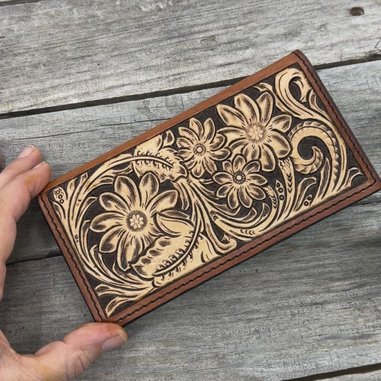 Hand carved floral leather checkbook cover with tooled floral design and oil tanned leather interior