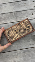 Hand carved floral leather checkbook cover with tooled floral design and oil tanned leather interior