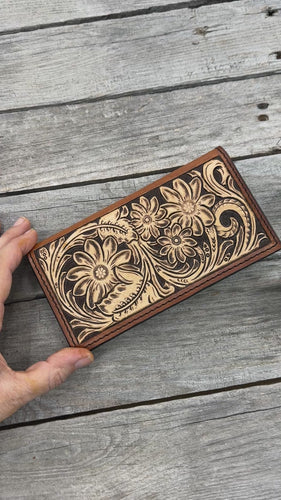 Hand carved floral leather checkbook cover with tooled floral design and oil tanned leather interior