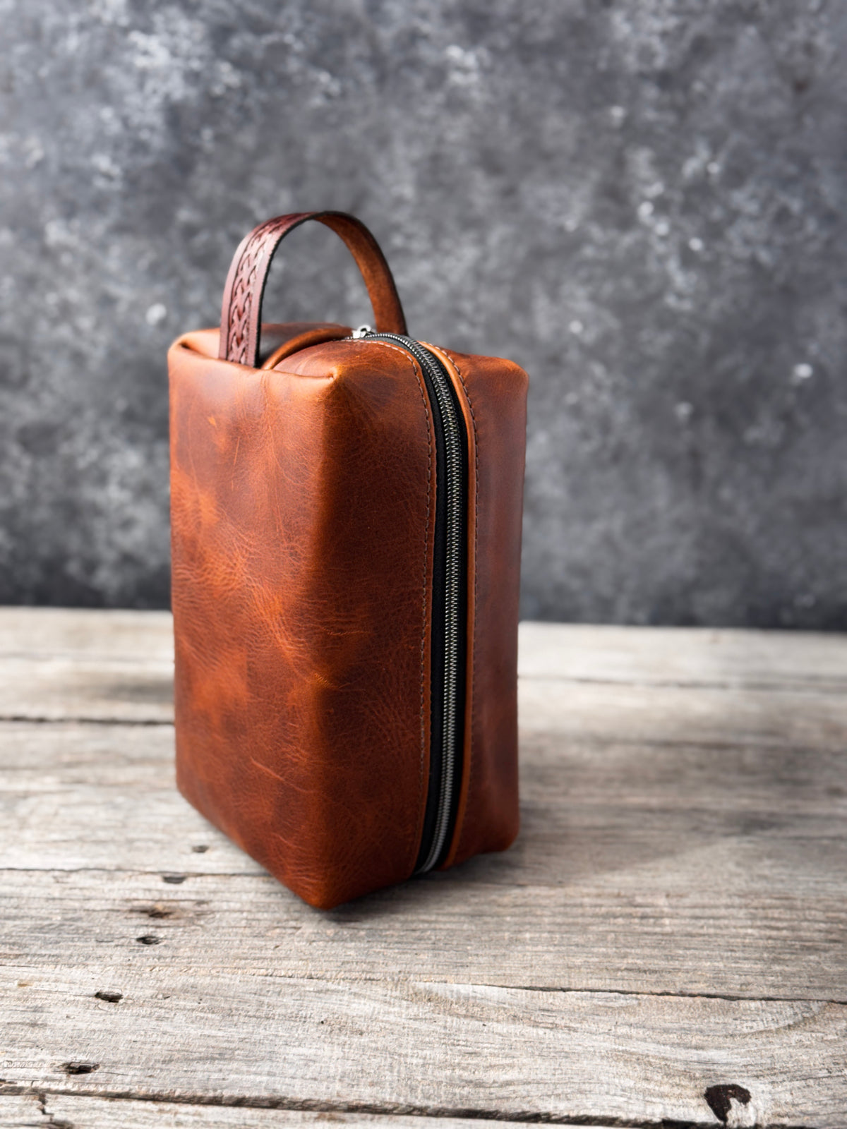 Rustic brown leather shaving kit side view showing natural distressed leather texture