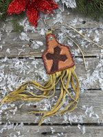 Hand painted leather purse charm in cattle tag shape with red cross design and deerskin fringe by Cherokee Rose Custom Leather in East Texas.