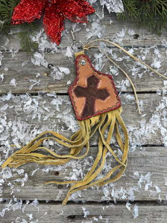 Hand painted leather purse charm in cattle tag shape with red cross design and deerskin fringe by Cherokee Rose Custom Leather in East Texas.