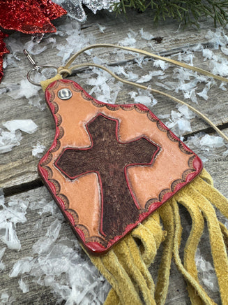 Hand painted leather purse charm in cattle tag shape with red cross design and deerskin fringe by Cherokee Rose Custom Leather in East Texas.