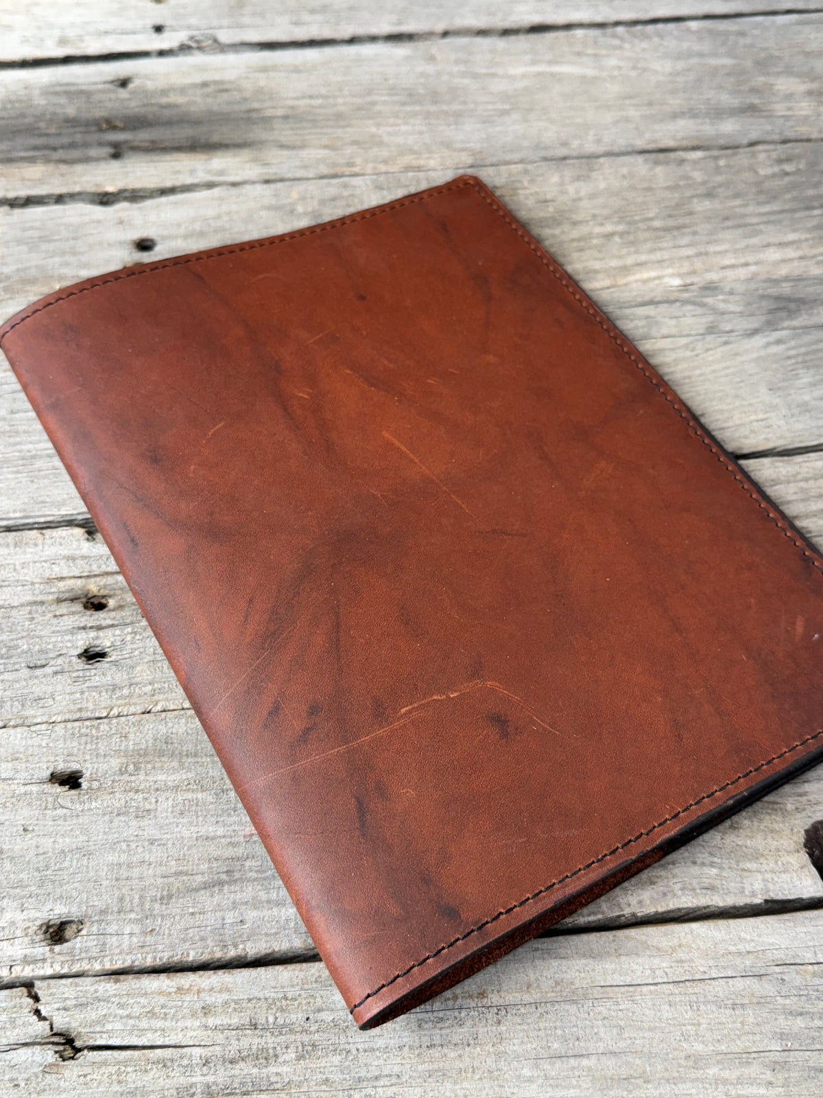 Redwood oil tanned leather composition notebook cover with natural dark marbling