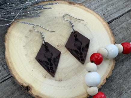 Small dark brown diamond leather earrings with geometric line stamping and sterling silver hooks, handmade by Cherokee Rose Custom Leather in East Texas.