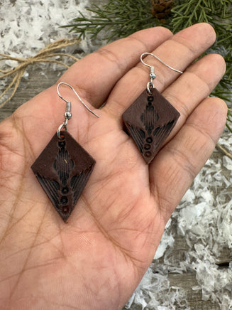 Small dark brown diamond leather earrings with geometric line stamping and sterling silver hooks, handmade by Cherokee Rose Custom Leather in East Texas.