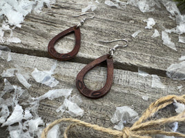 Small hand-stamped leather teardrop earrings with floral and rope design, chocolate brown with sterling silver hooks, handmade by Cherokee Rose Custom Leather in Texas.