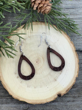 Small hand-stamped leather teardrop earrings with floral and rope design, chocolate brown with sterling silver hooks, handmade by Cherokee Rose Custom Leather in Texas.
