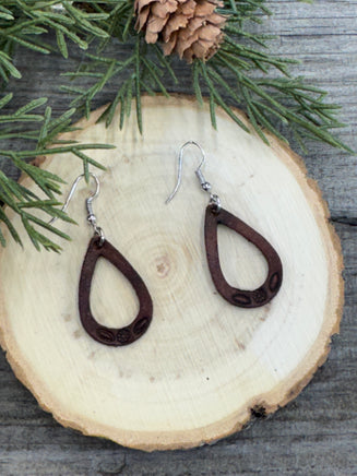 Small hand-stamped leather teardrop earrings with floral and rope design, chocolate brown with sterling silver hooks, handmade by Cherokee Rose Custom Leather in Texas.